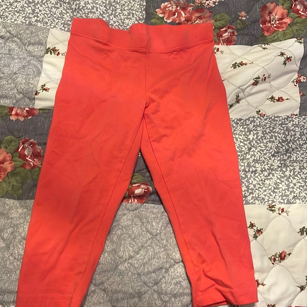 Pink mid length leggings.